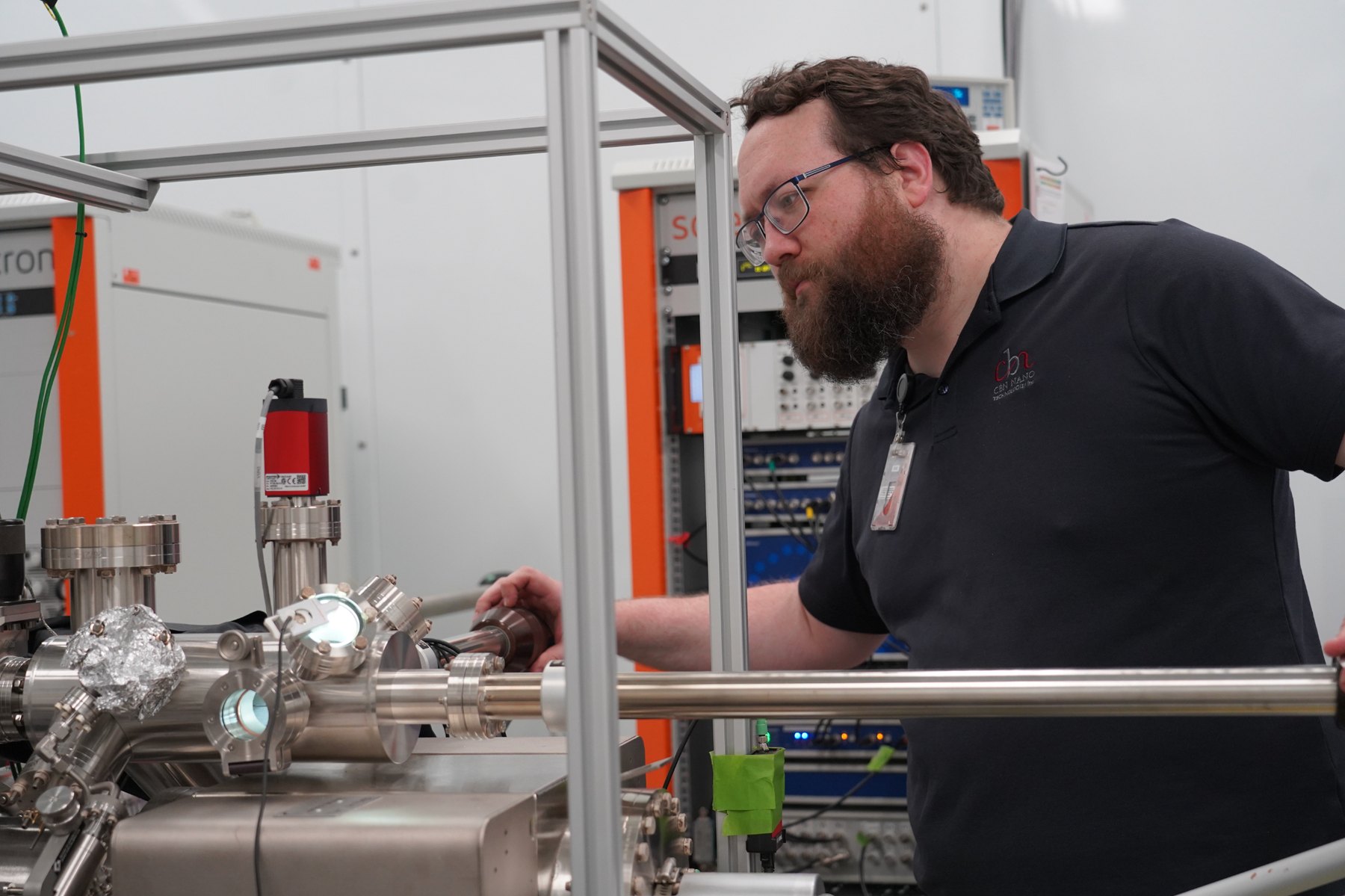 A CBN Nano scientist operating the sample manipulator on an ultra-high-vacuum molecular workstation, Ottawa